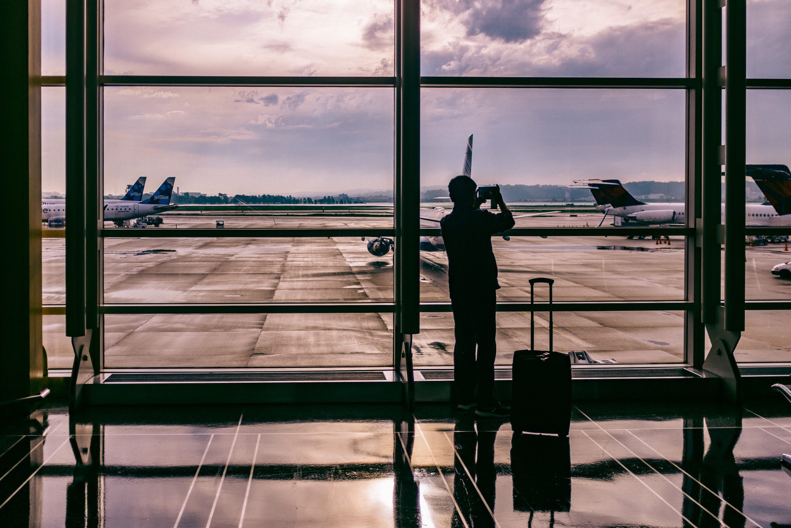 A man at the airport illustrating millennial business travellers