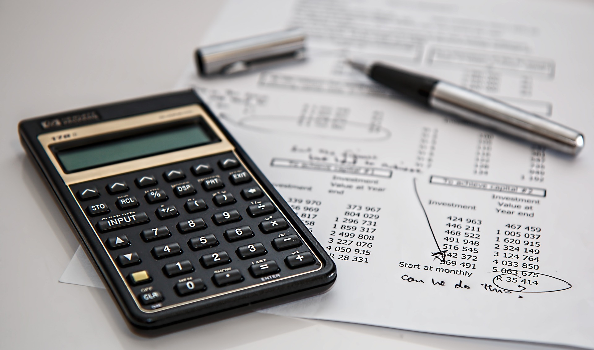 a photo of a calculator and taxes illustrating tax recovery