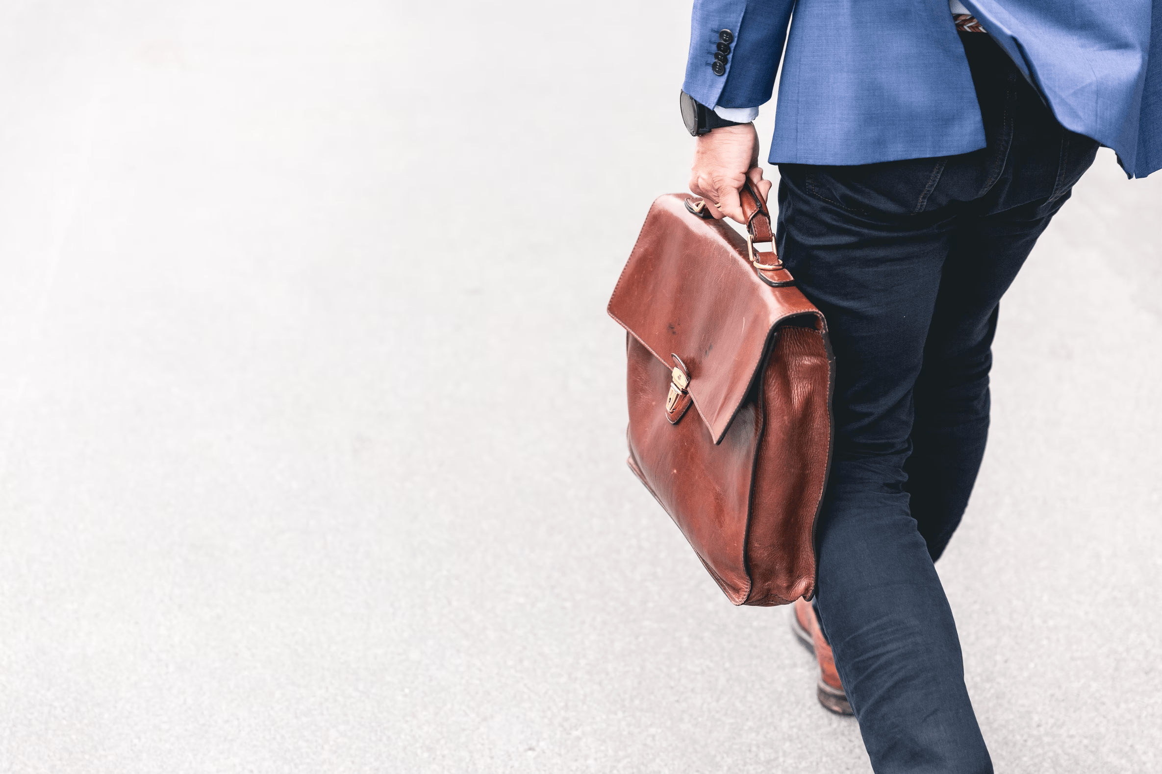 A finance leader with blue jacket taking his brown bag