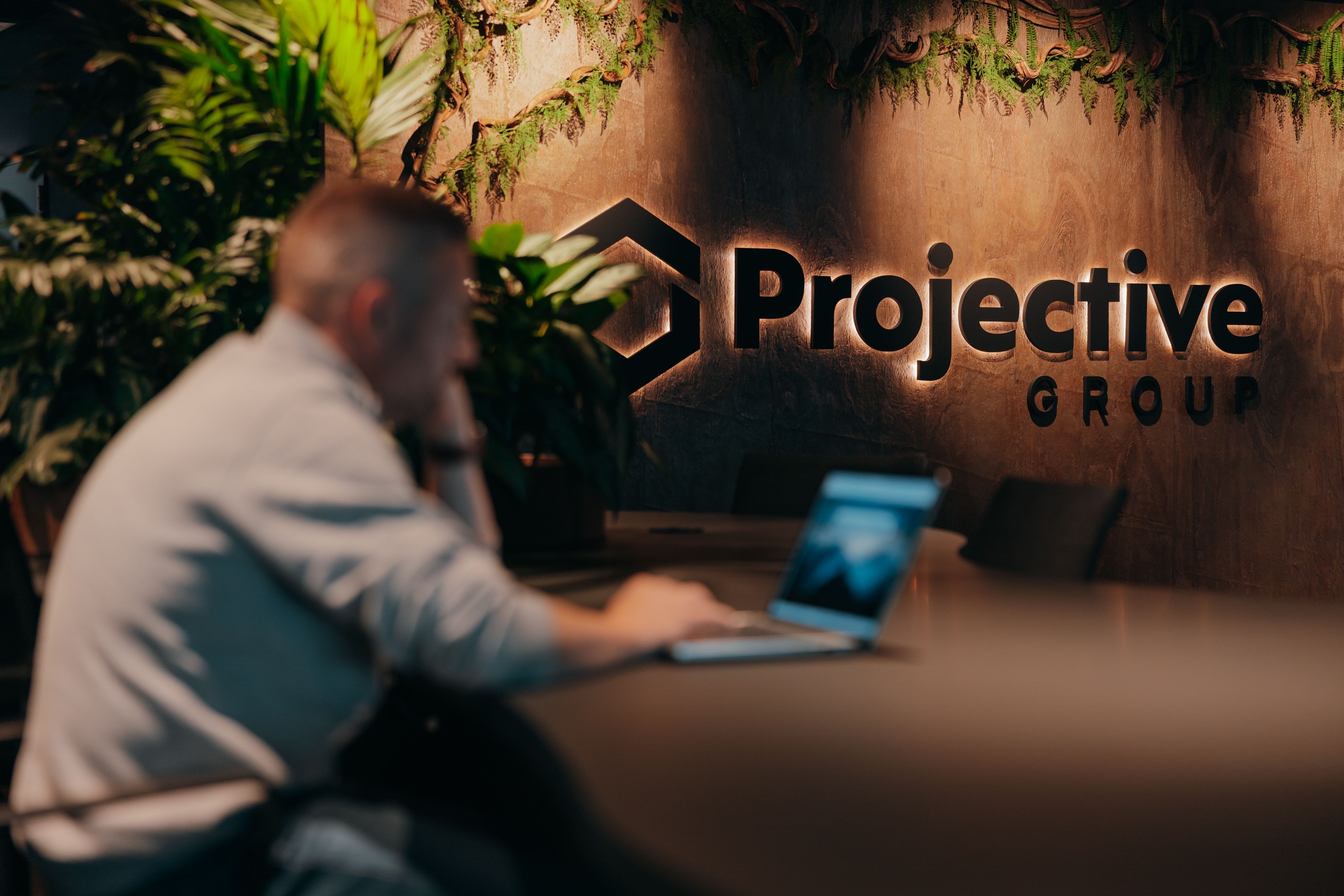 Projective Group employee at work in the Belgian office – Projective case study with Rydoo